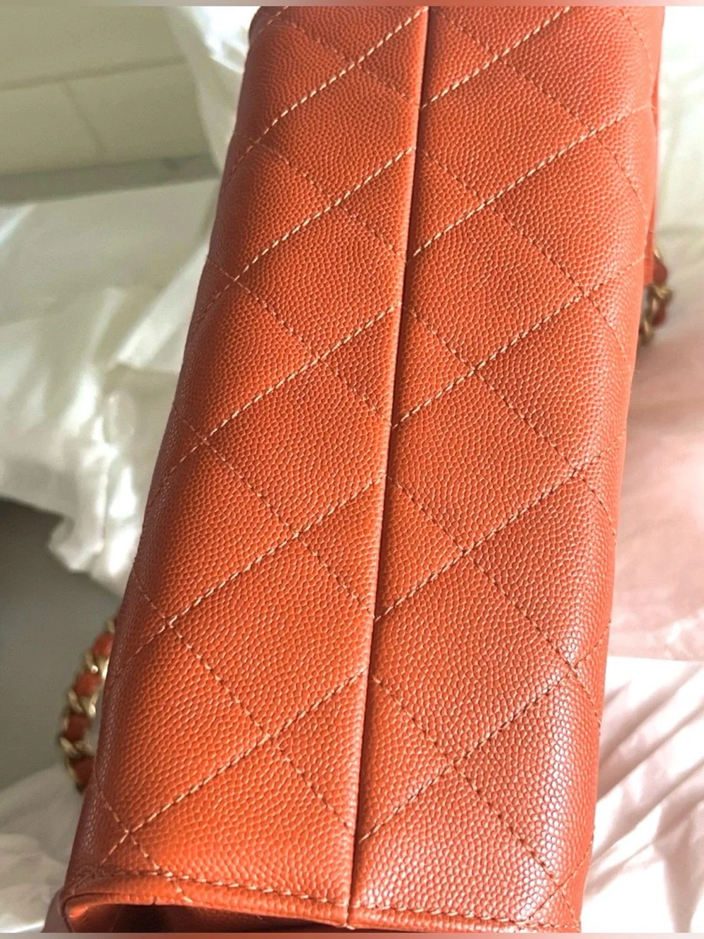 CHANEL Orange Quilted Drawstring Shoulder Bag with Gold Chain